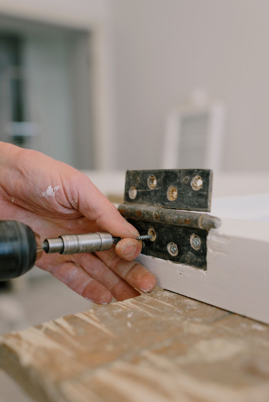 Carpenter fixing door lock alignment